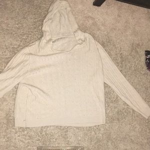 A tan sweater a hood